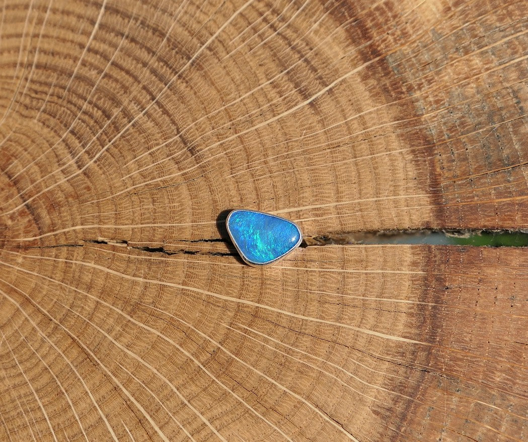 Silver tie tack with Coober Pedy opal.
