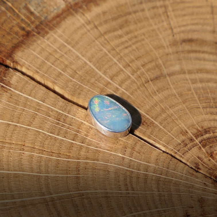 Silver tie tack with Coober Pedy opal.