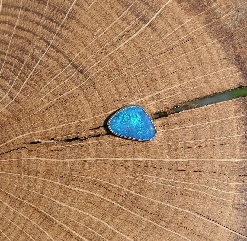 Silver tie tack with Coober Pedy opal.