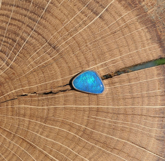 Silver tie tack with Coober Pedy opal.