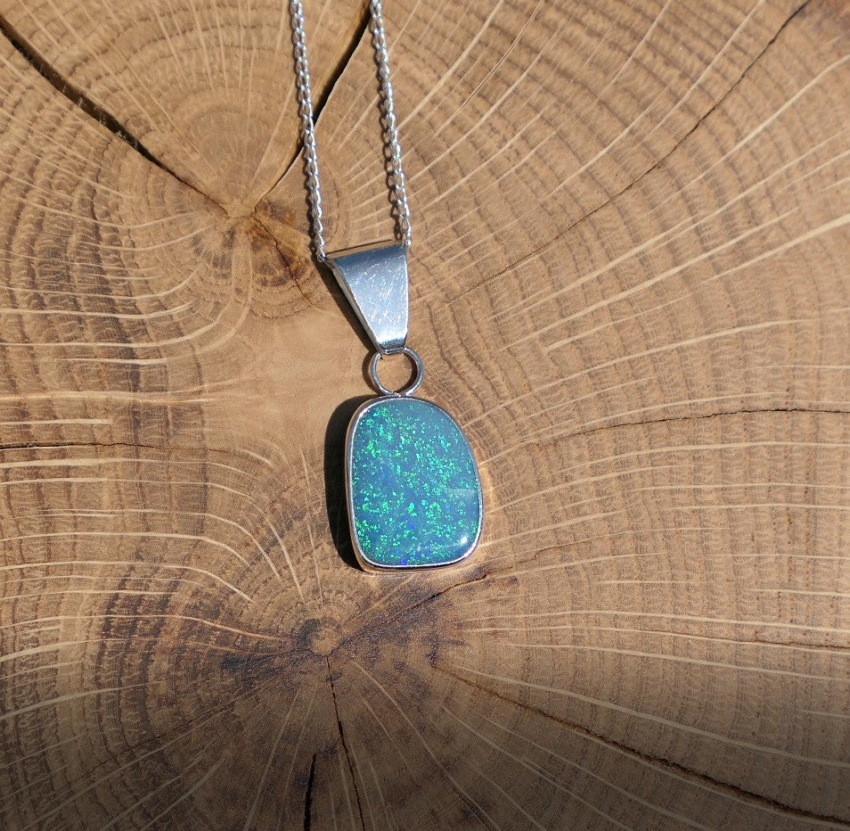 Silver opal pendant with a Coober Pedy doublet.