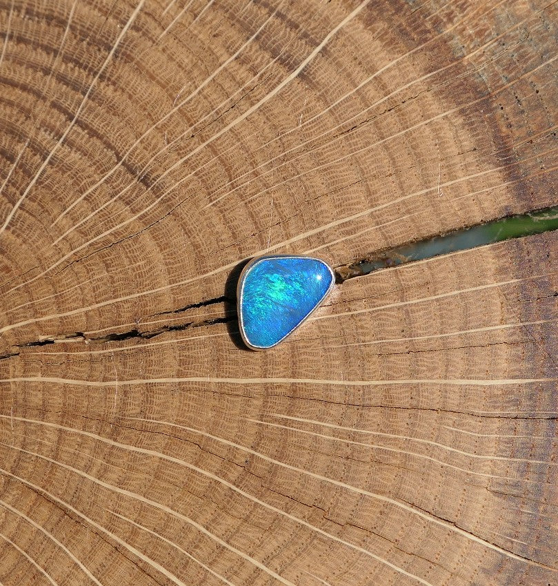 Silver tie tack with Coober Pedy opal.