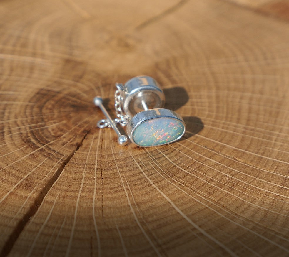 Silver tie tack with Coober Pedy opal.