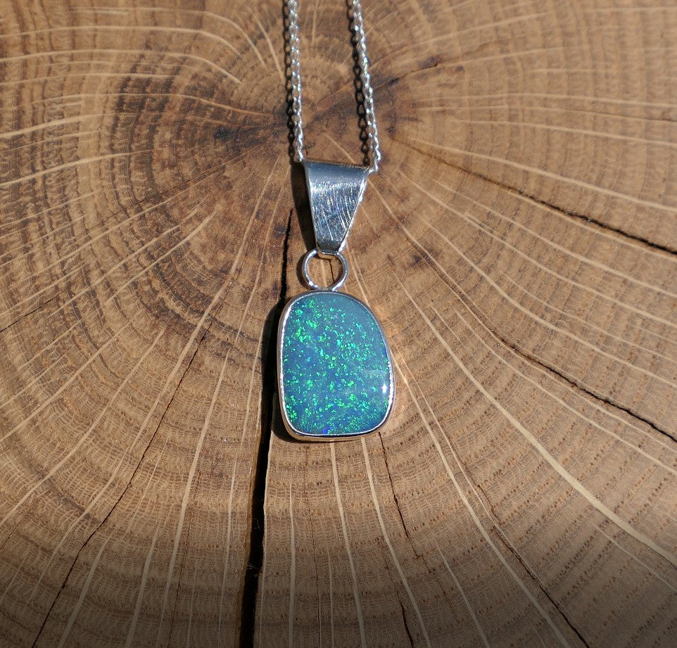 Silver opal pendant with a Coober Pedy doublet.