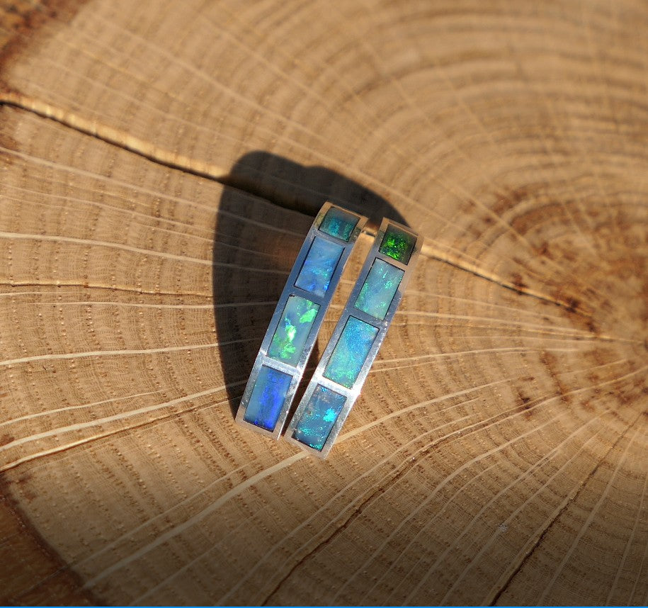 Silver hoop earrings with bright opal inlay