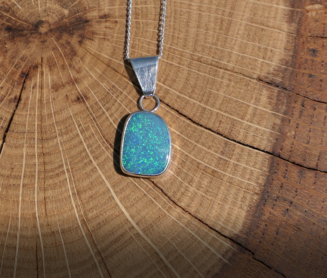 Silver opal pendant with a Coober Pedy doublet.