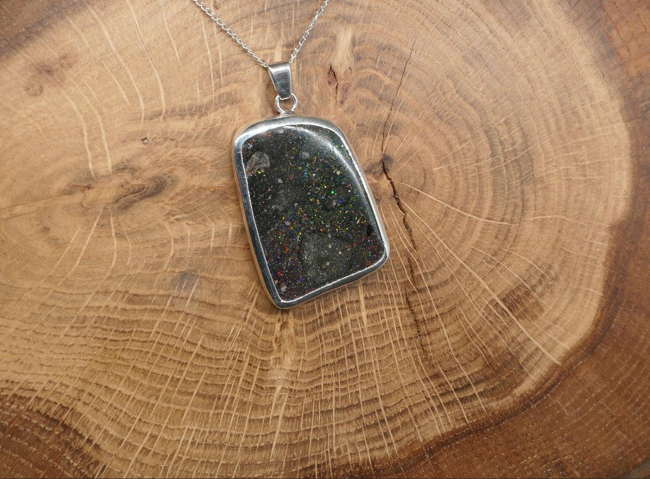 Double sided silver pendant with a Honduran matrix opal