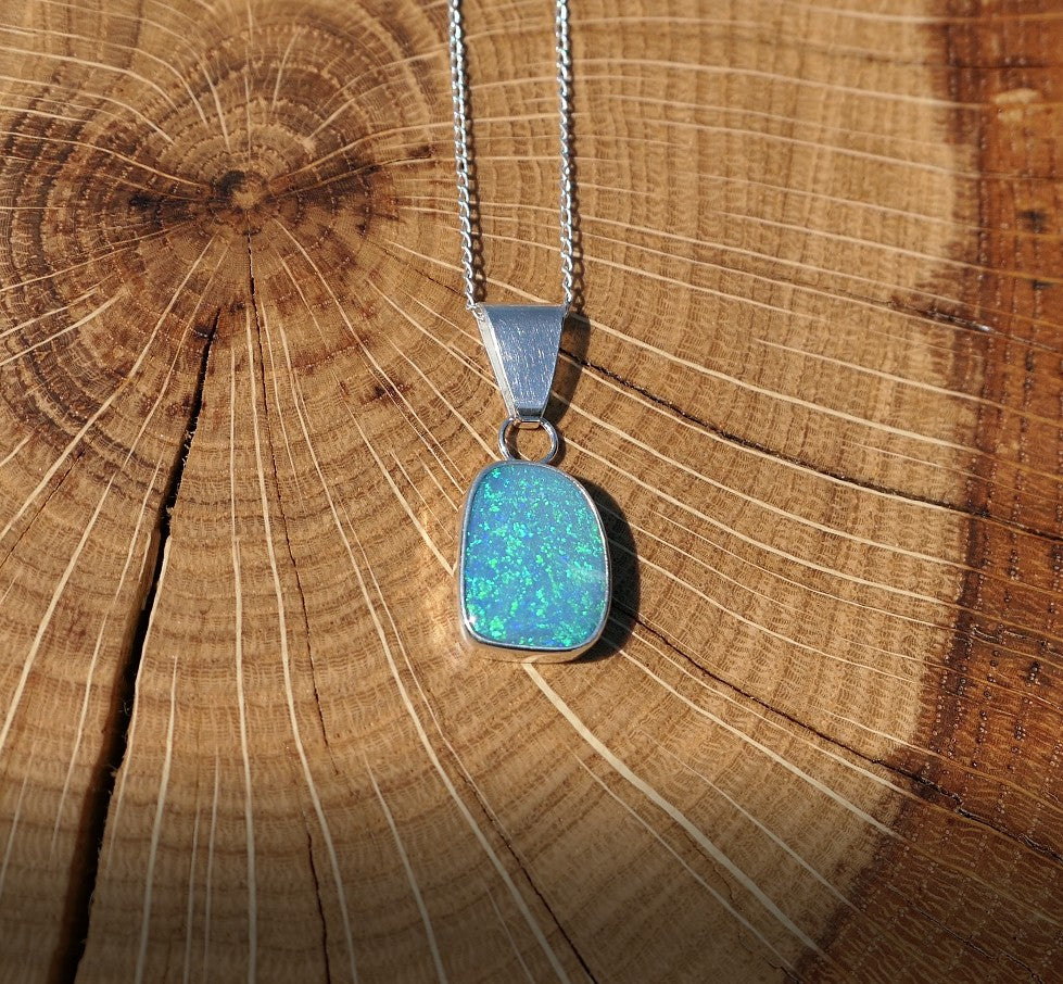 Silver opal pendant with a Coober Pedy doublet.