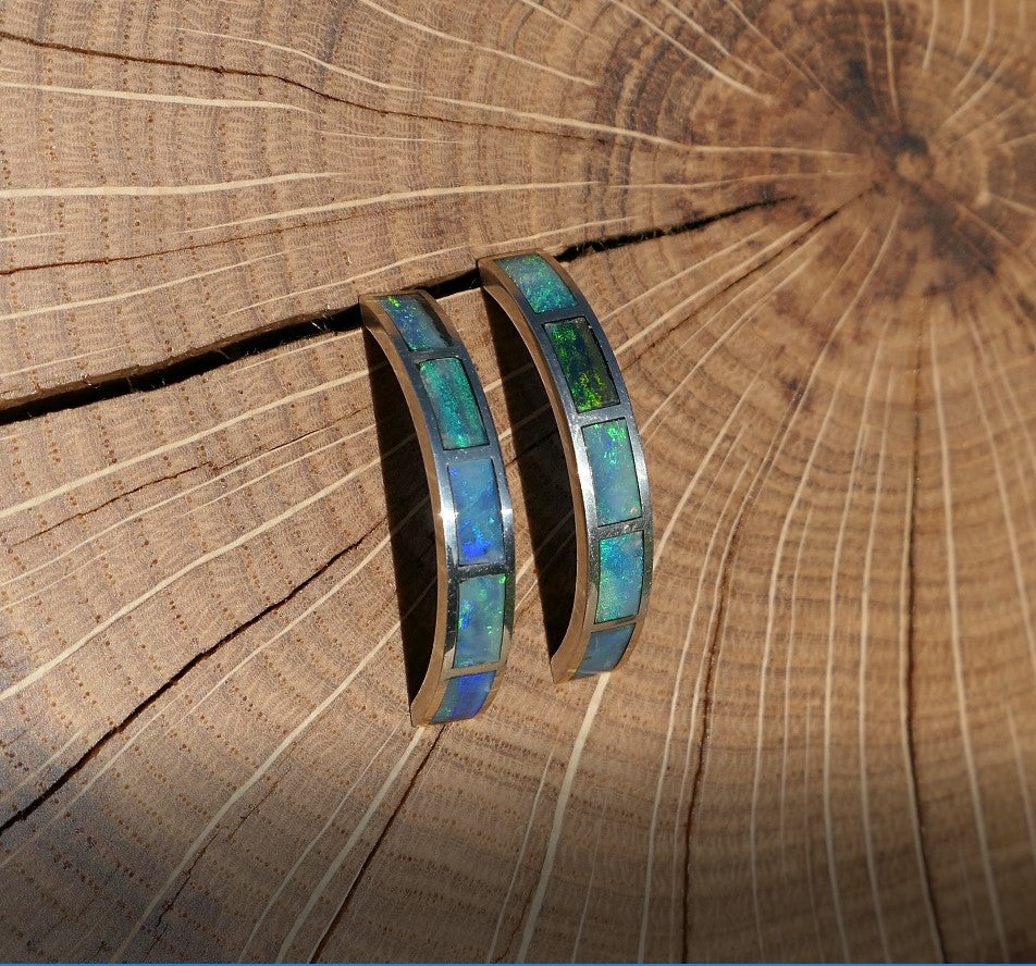 Silver hoop earrings with bright opal inlay