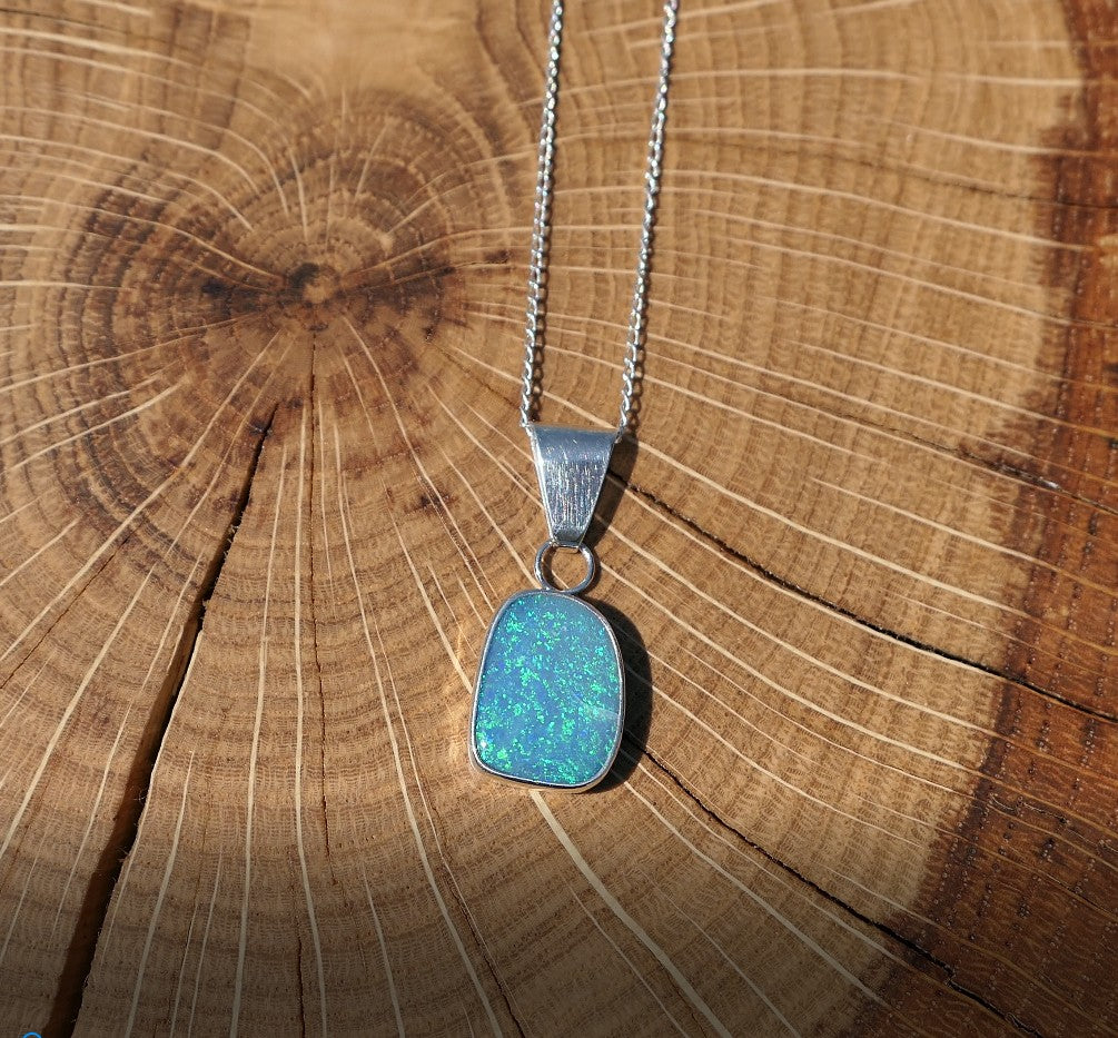 Silver opal pendant with a Coober Pedy doublet.
