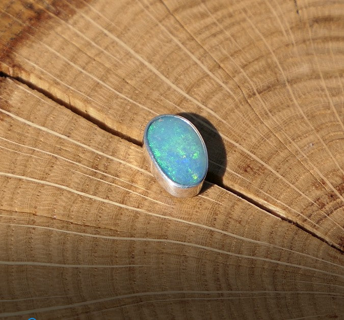 Silver tie tack with Coober Pedy opal.