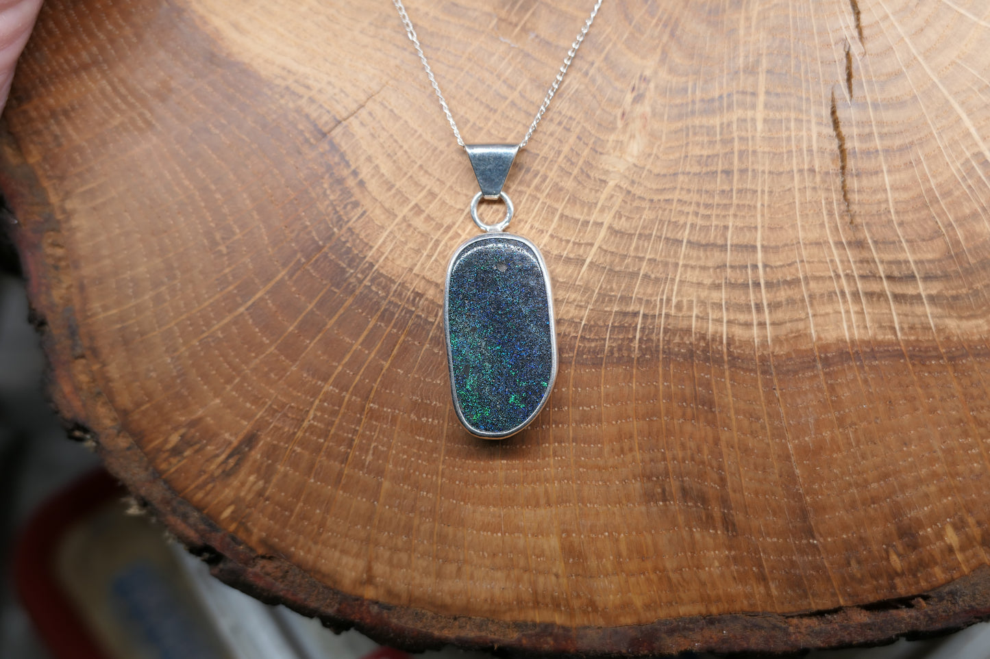 Silver opal pendant with an Andamooka marix opal