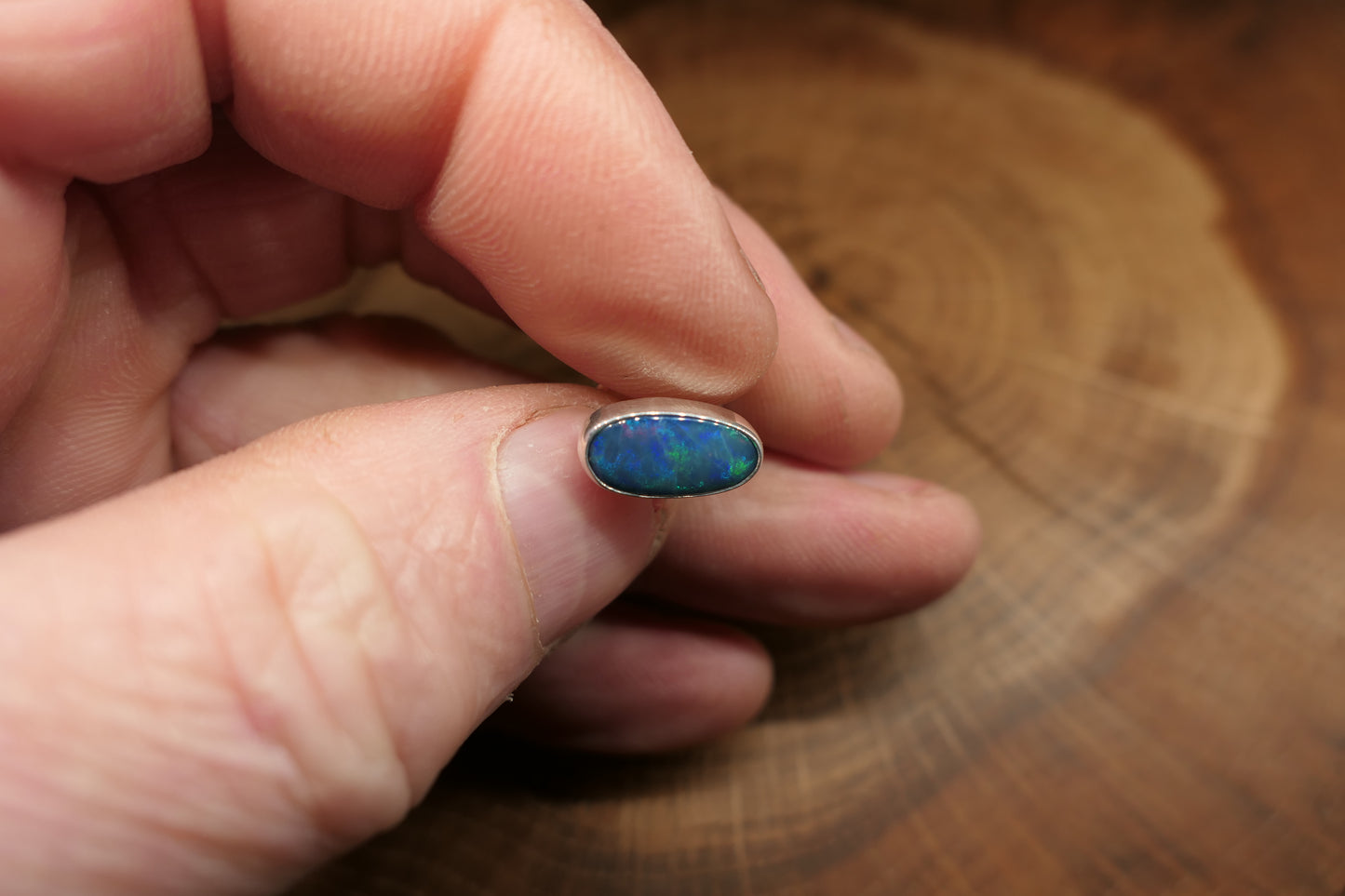 Silver tie tack with an Andamooka doublet opal