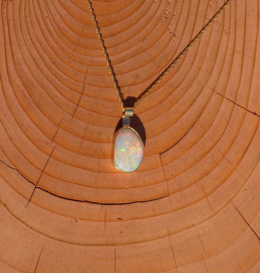 Gorgeous Coober Pedy solid opal set in 9ct gold bezel