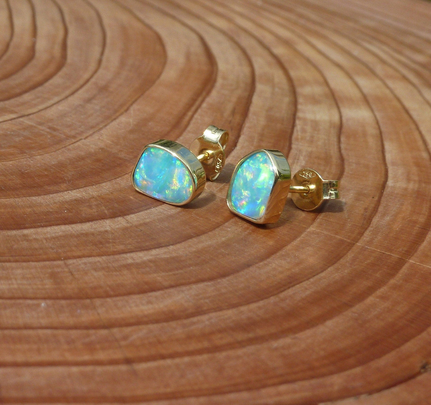 Matching 18k gold opal ear studs