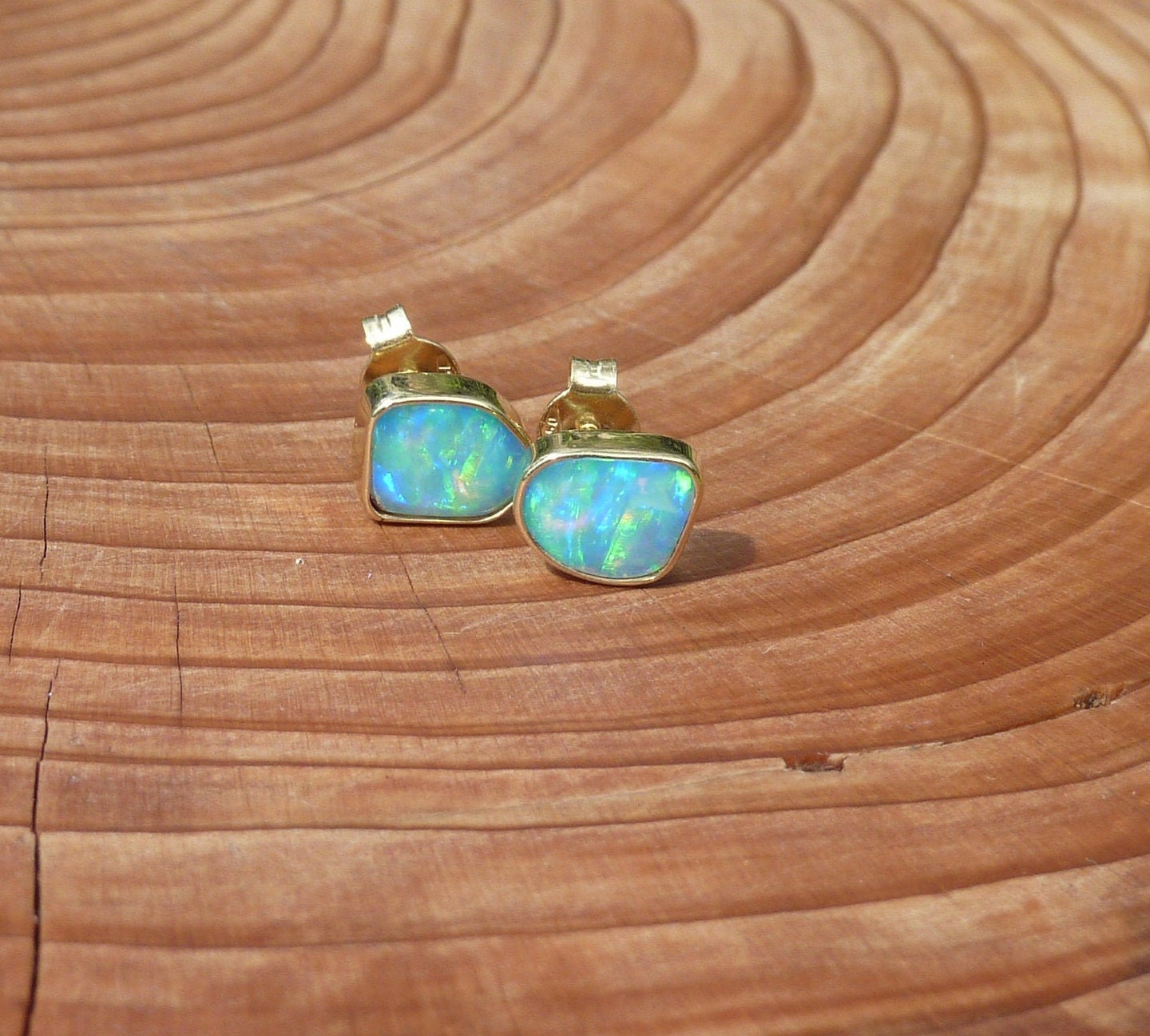 Matching 18k gold opal ear studs