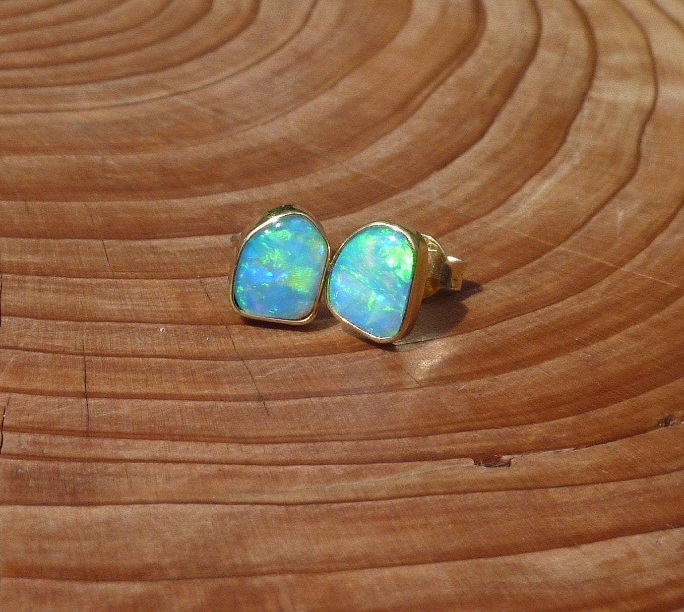 Matching 18k gold opal ear studs