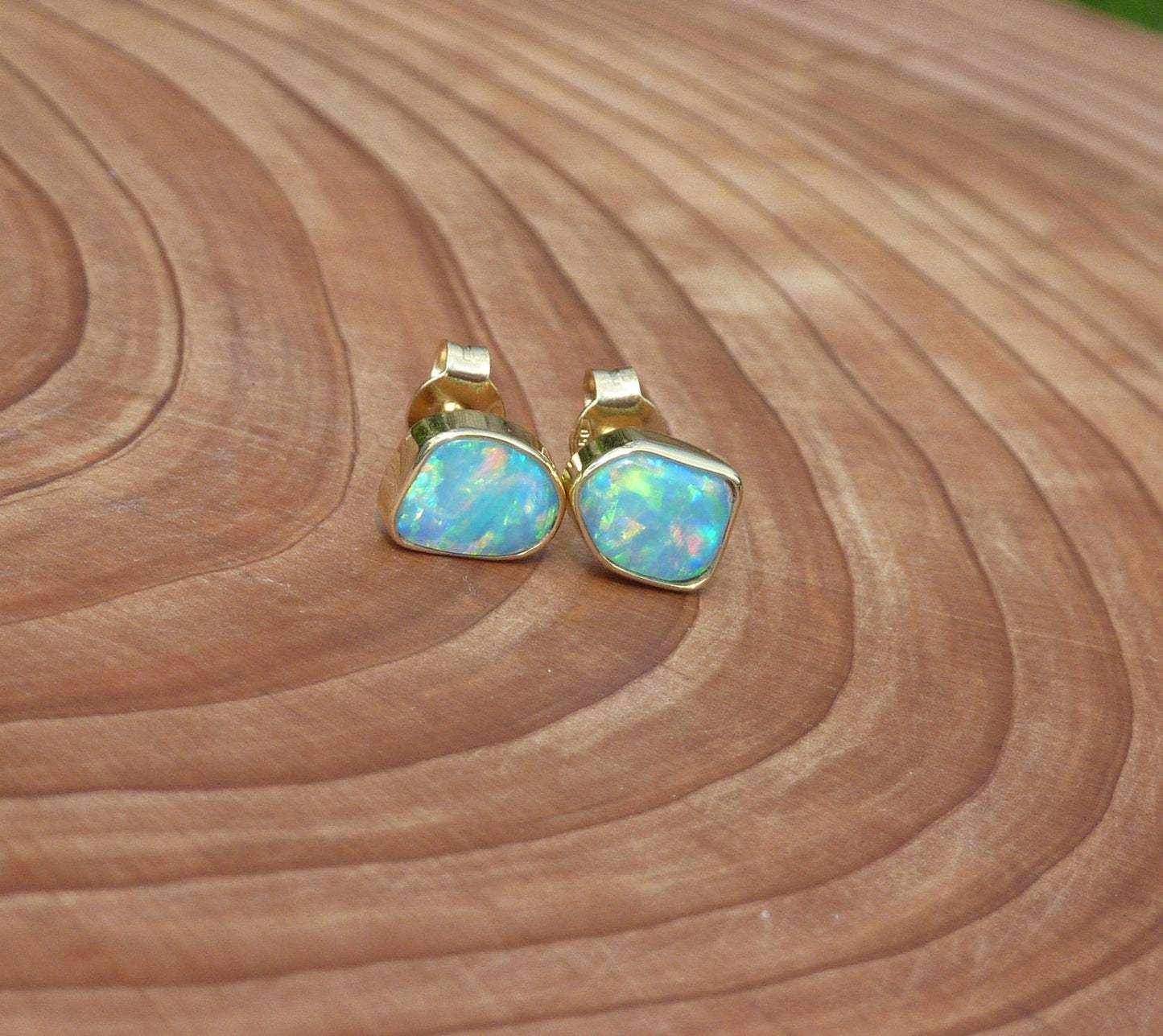 Matching 18k gold opal ear studs