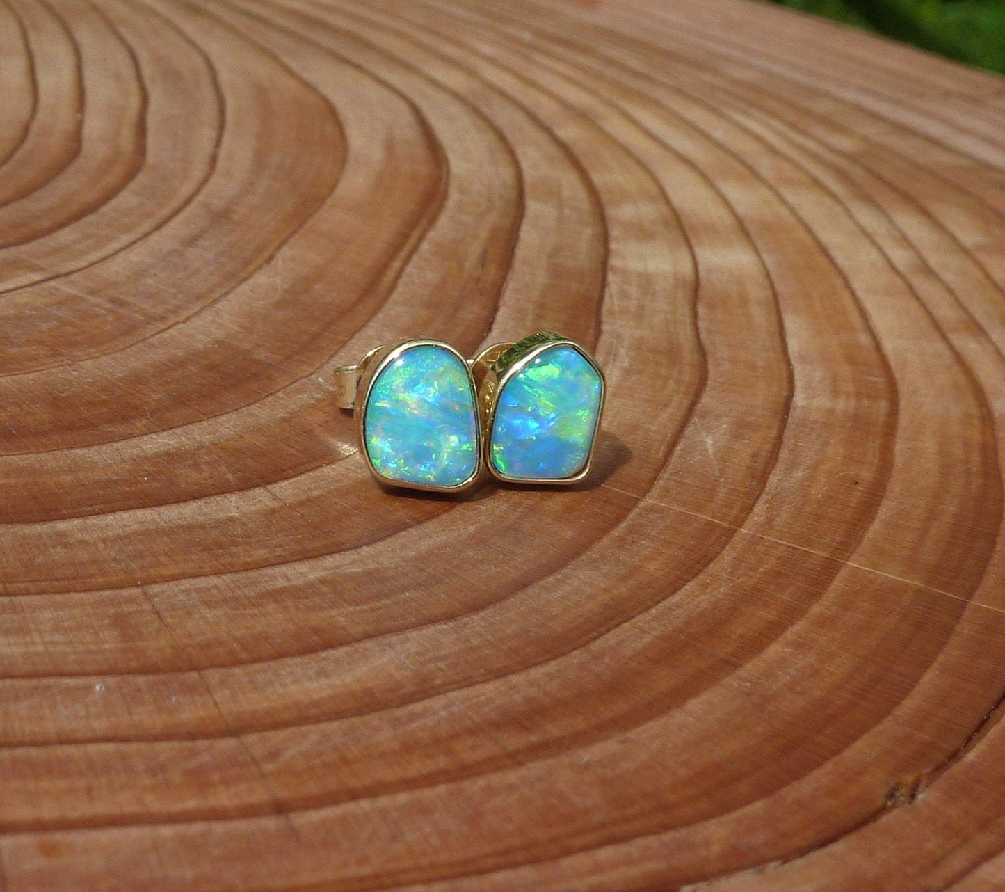 Matching 18k gold opal ear studs