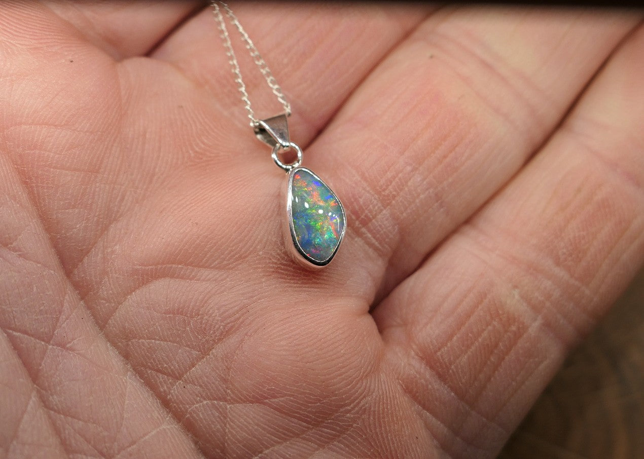 Opalised shell pendant