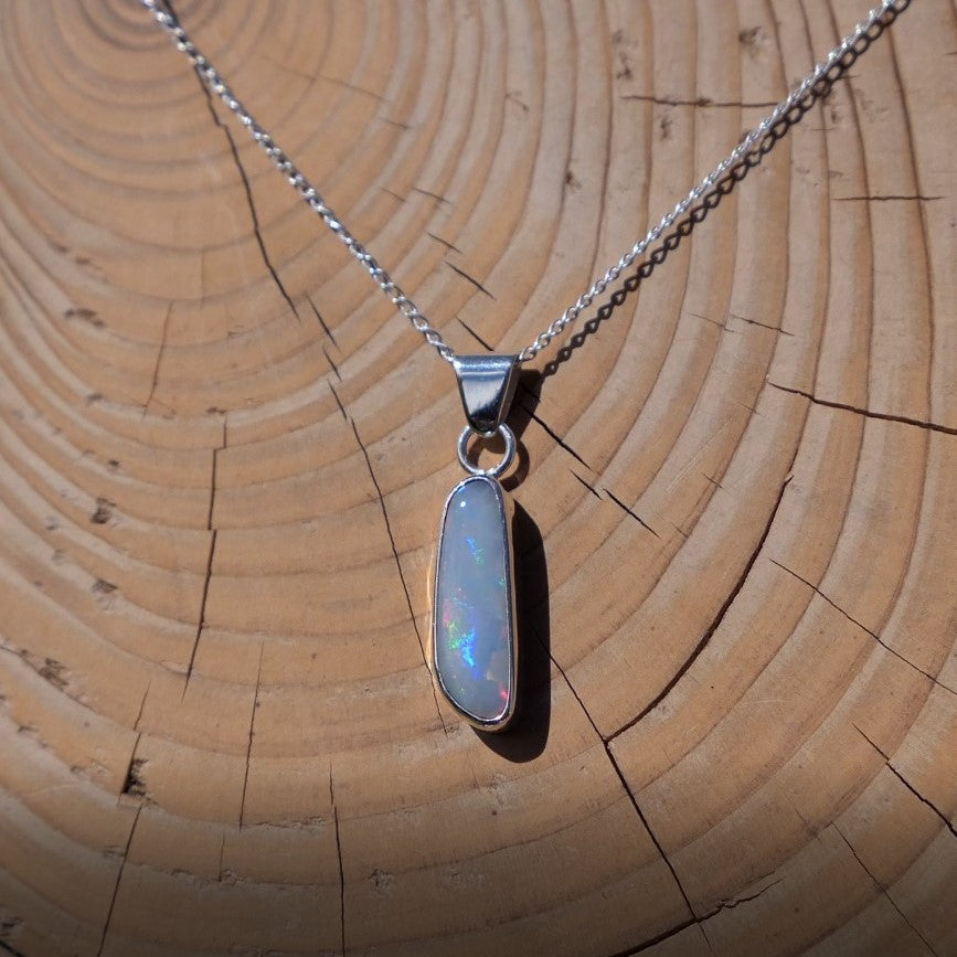 Silver pendant with white base Coober Pedy opal.