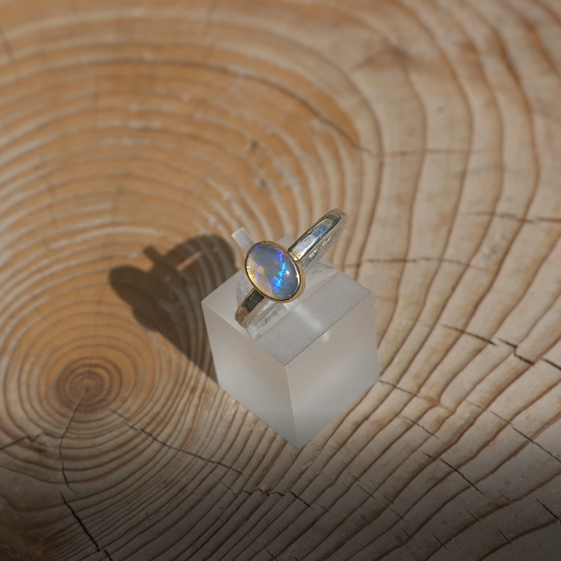 Silver opal ring with 18k gold bezel