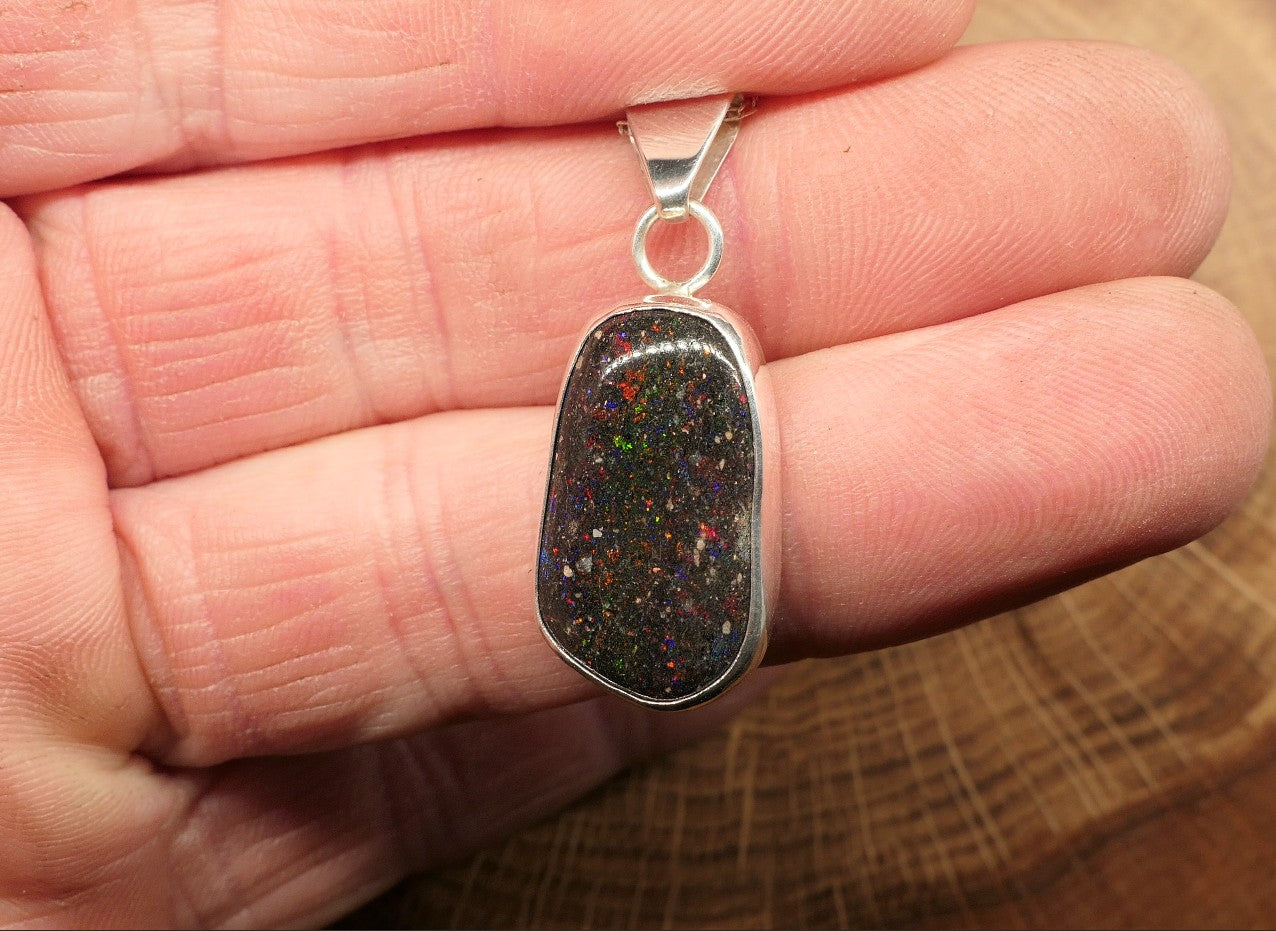 Silver opal pendant with a Honduran matrix opal