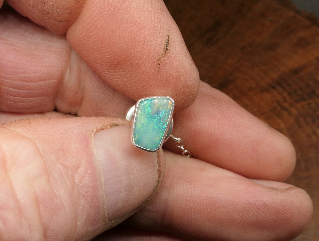 Silver tie tack with a Coober Pedy opal
