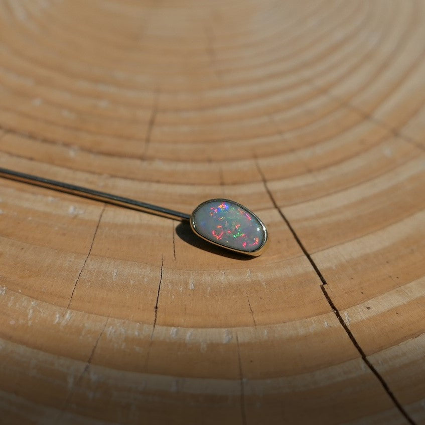 Lightning Ridge opal tie pin, opal is 0.75ct, measures 9x5mm, semi black n6 body tone, 4/5 brightness.