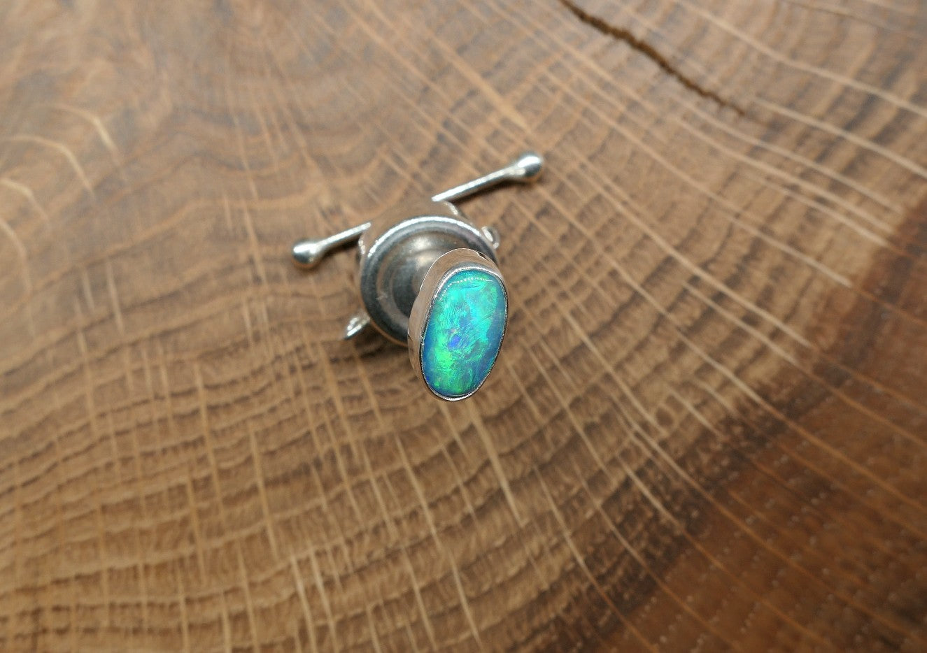 Silver tie tack with a Coober Pedy opal