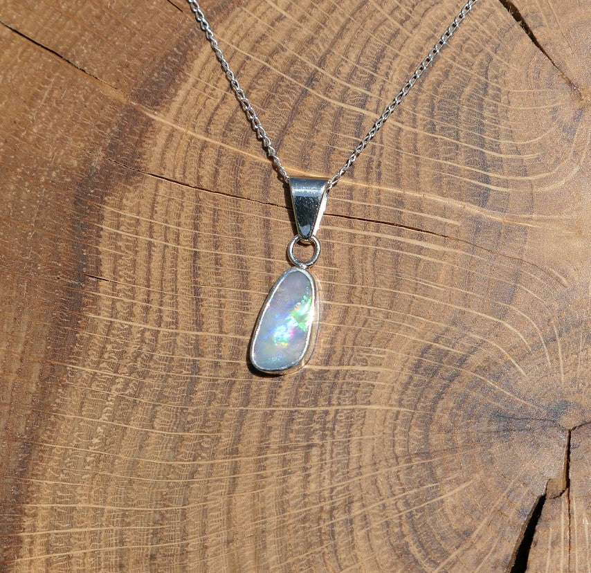 Silver opal pendant with a Mintabie solid opal