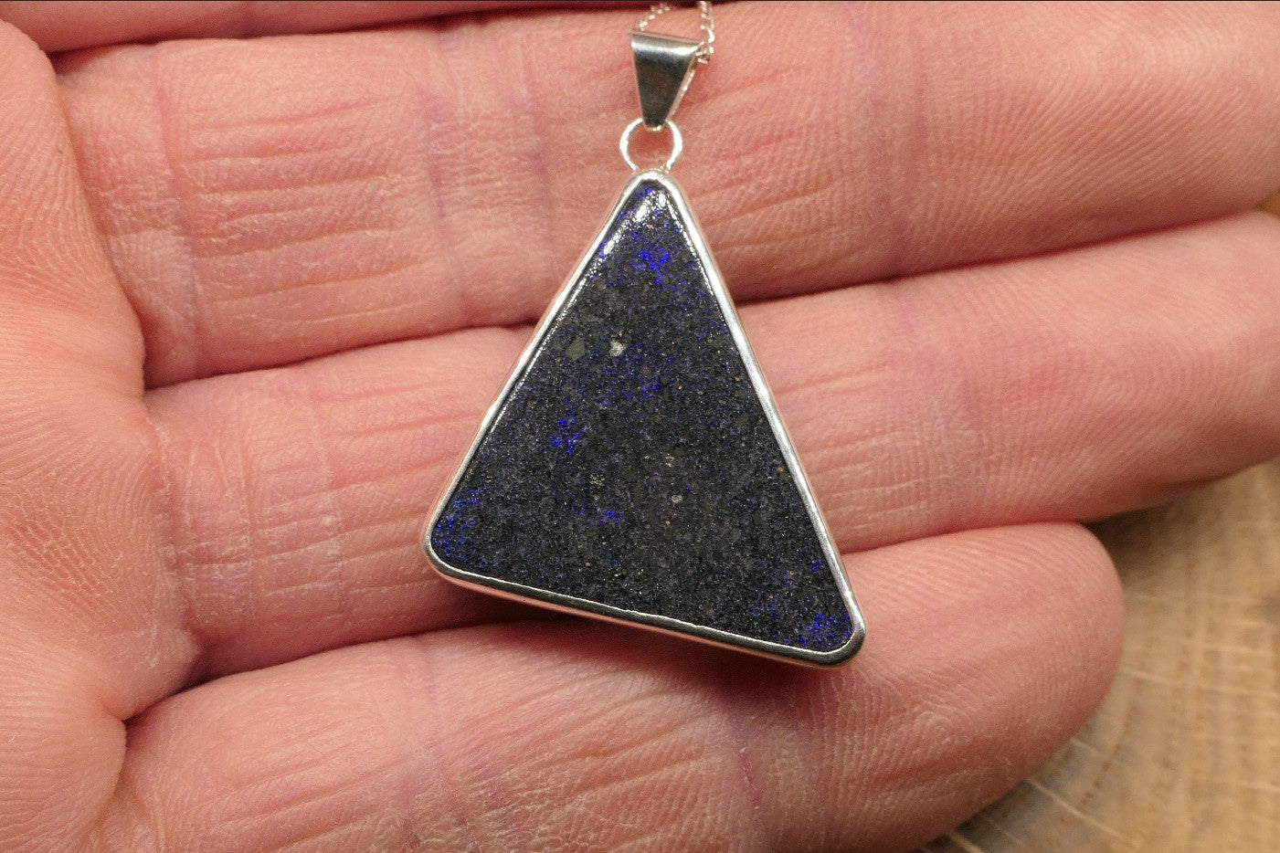 Silver opal pendant with an Andamooka matrix opal