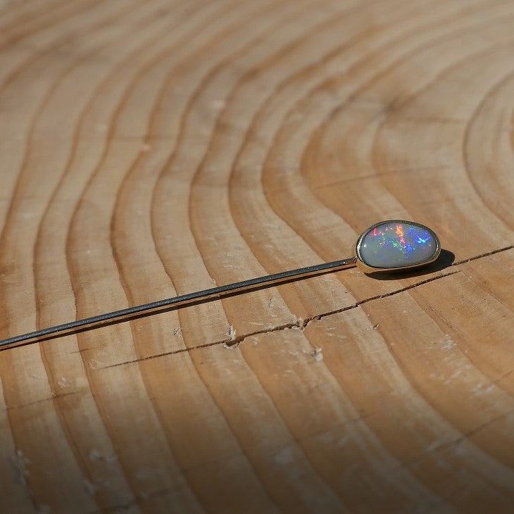 Lightning Ridge opal tie pin, opal is 0.75ct, measures 9x5mm, semi black n6 body tone, 4/5 brightness.