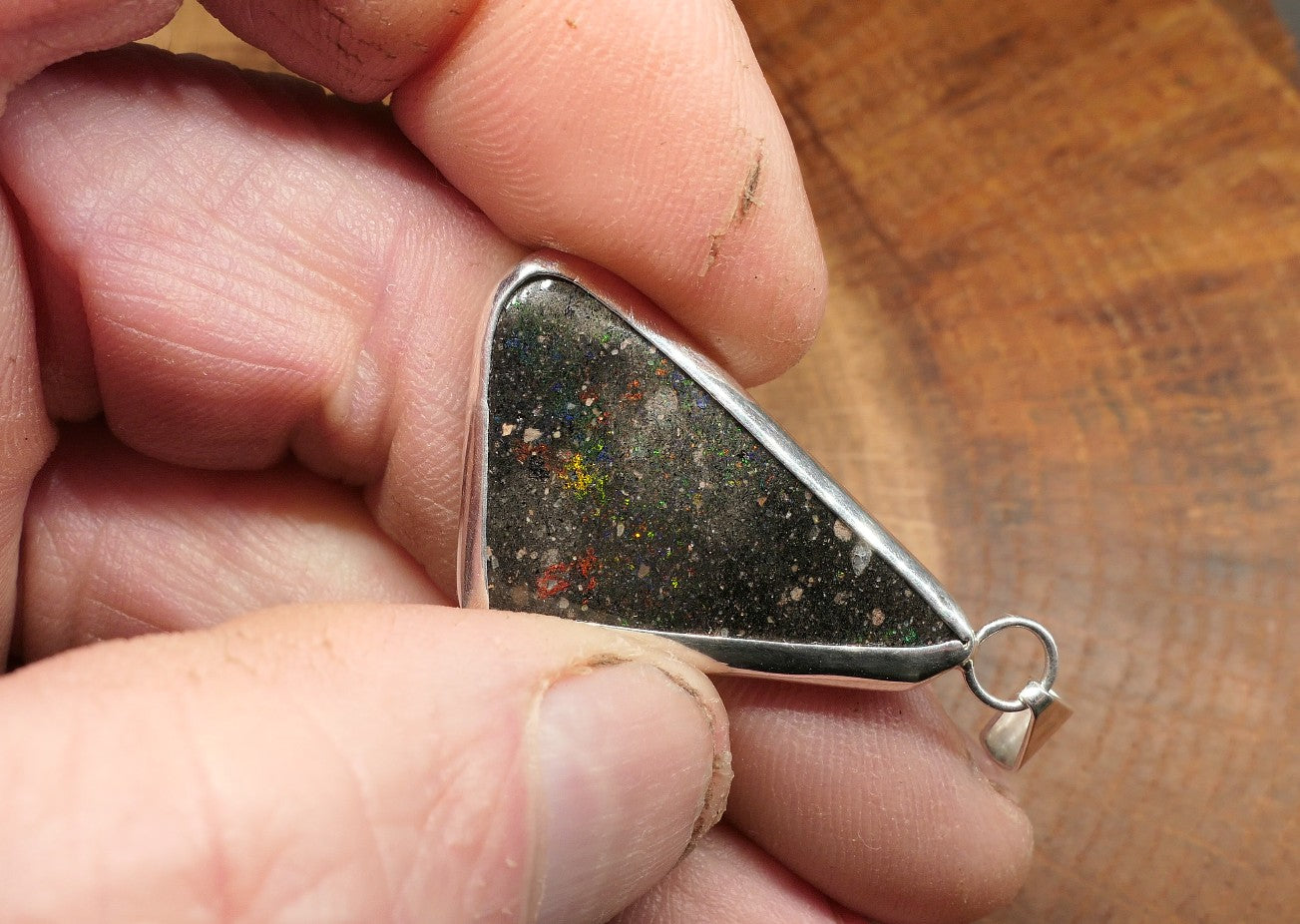 Double sided silver pendant with a Honduran matrix opal
