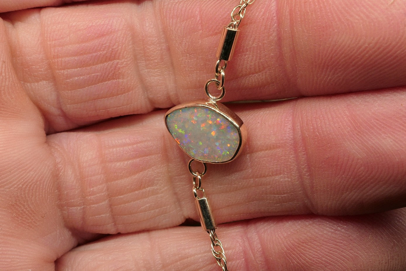 9k gold opal bracelet with a Lightning Ridge semi-black opal