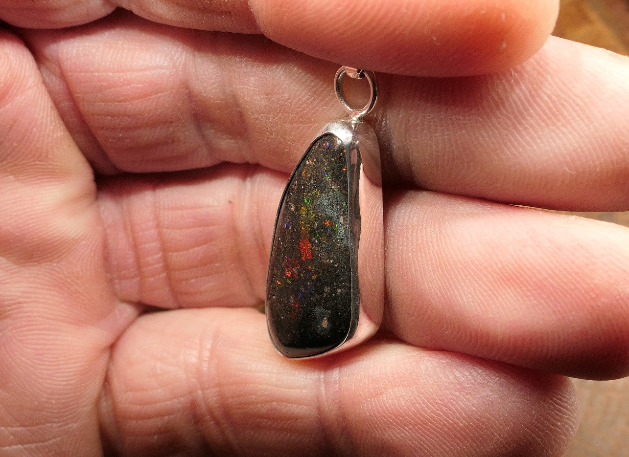 Silver opal pendant with a Honduran matrix opal