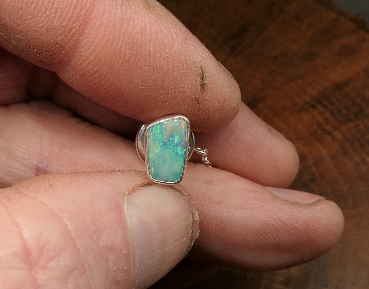 Silver tie tack with a Coober Pedy opal