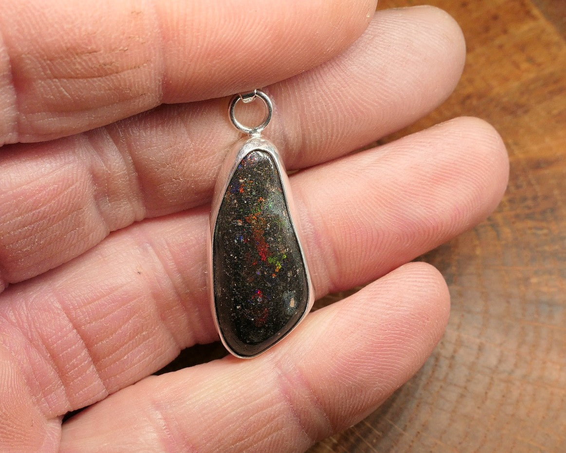 Silver opal pendant with a Honduran matrix opal