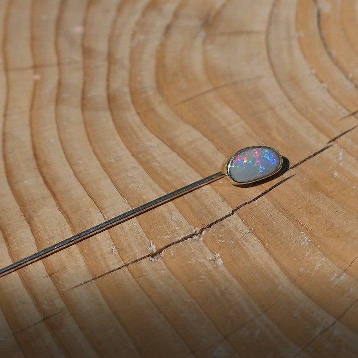 Lightning Ridge opal tie pin, opal is 0.75ct, measures 9x5mm, semi black n6 body tone, 4/5 brightness.