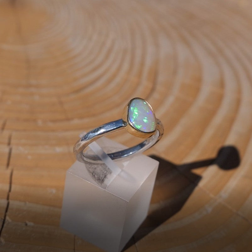 Lightning Ridge crystal opal ring with 18k gold bezel