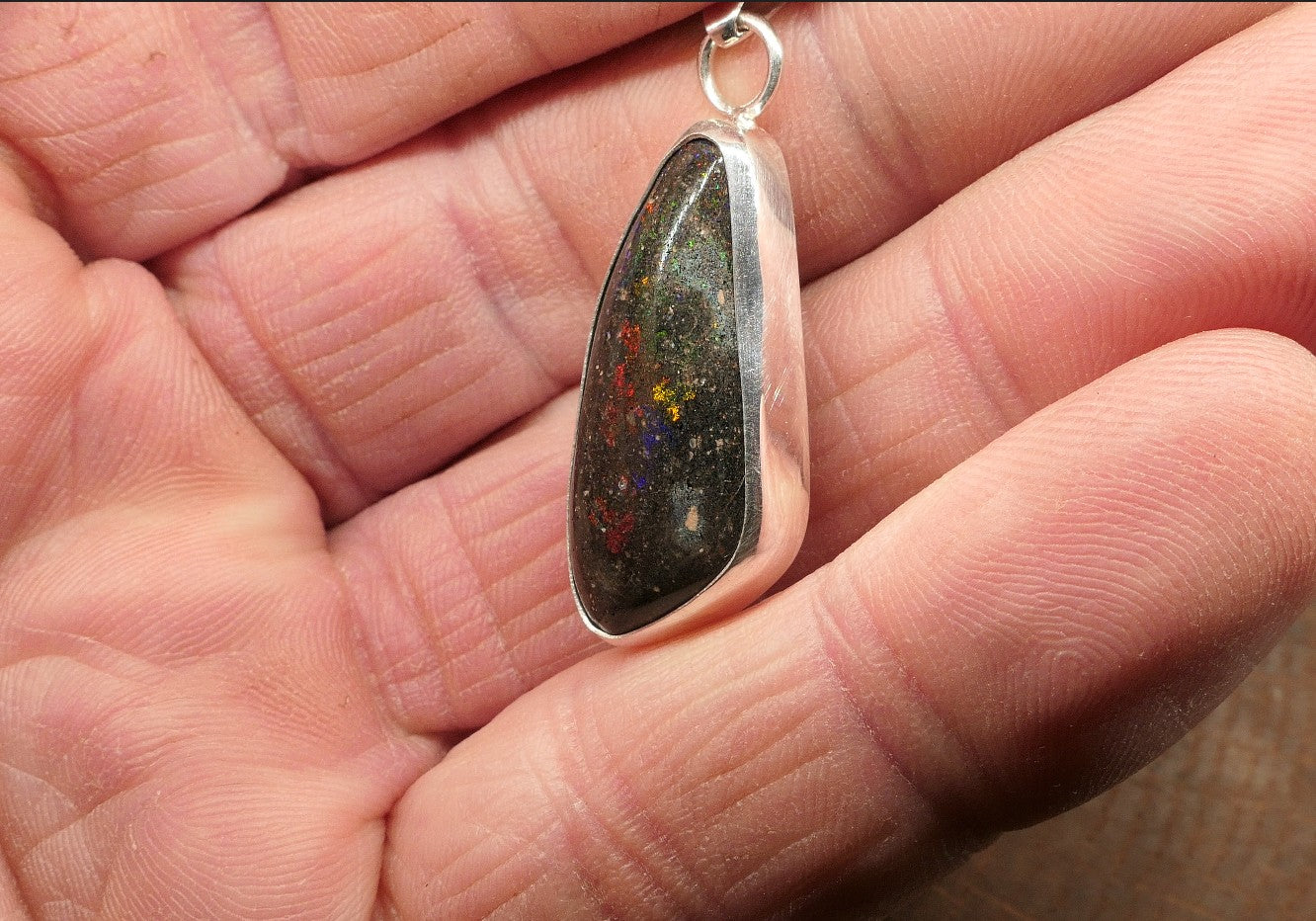 Silver opal pendant with a Honduran matrix opal