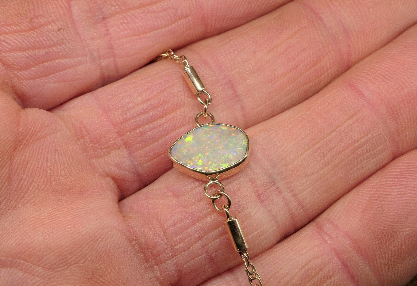 9k gold opal bracelet with a Lightning Ridge semi-black opal