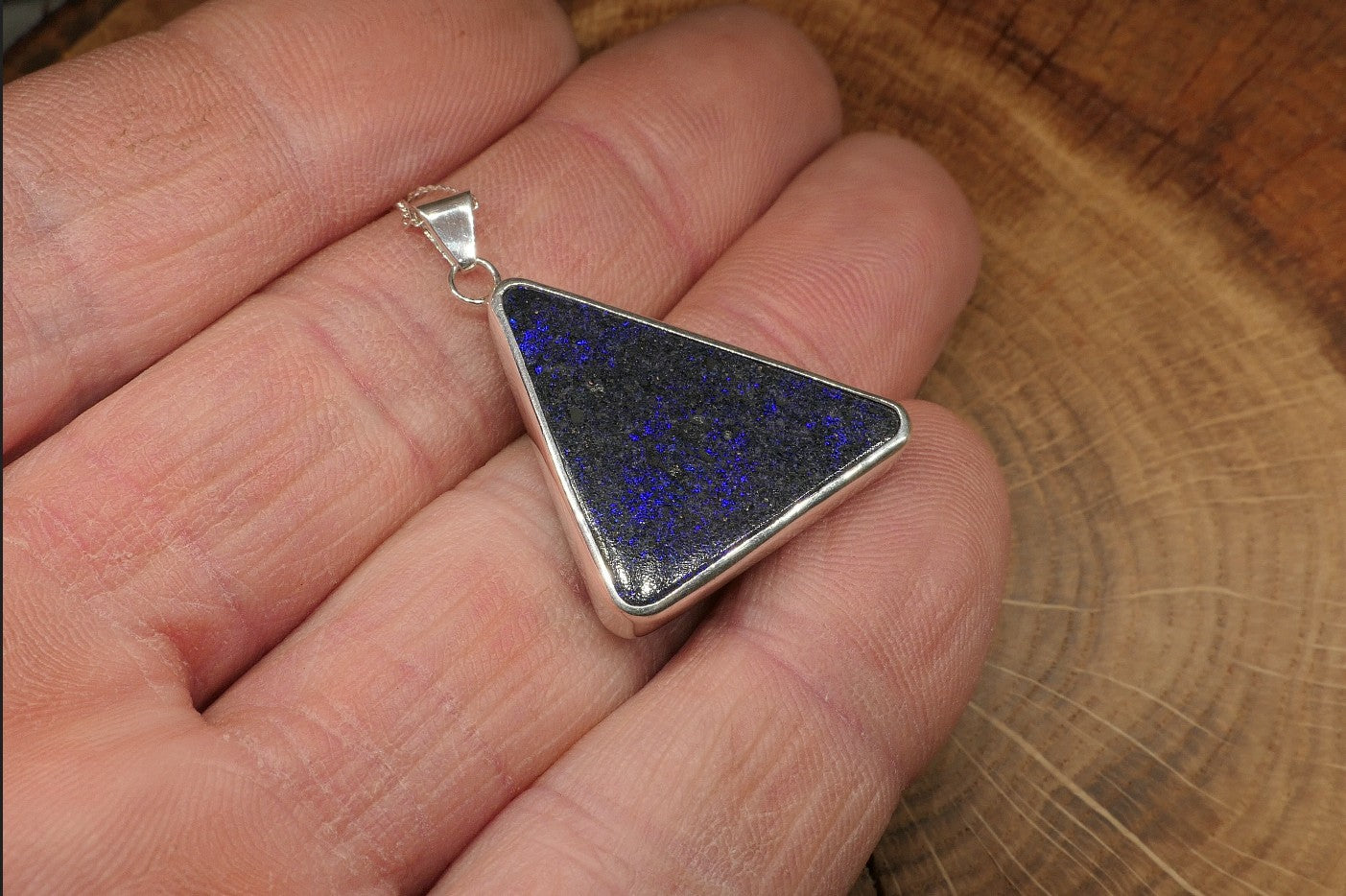 Silver opal pendant with an Andamooka matrix opal