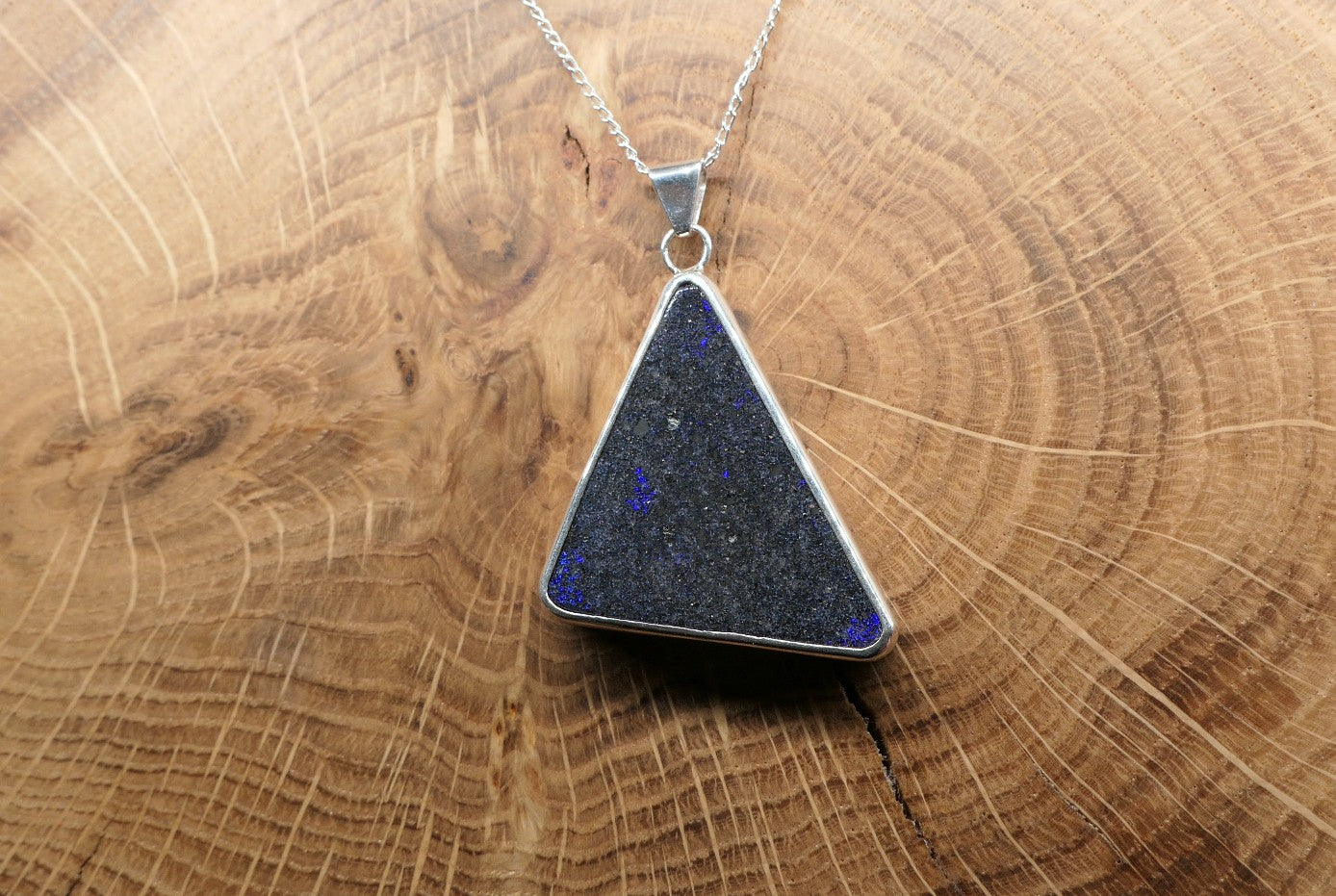 Silver opal pendant with an Andamooka matrix opal