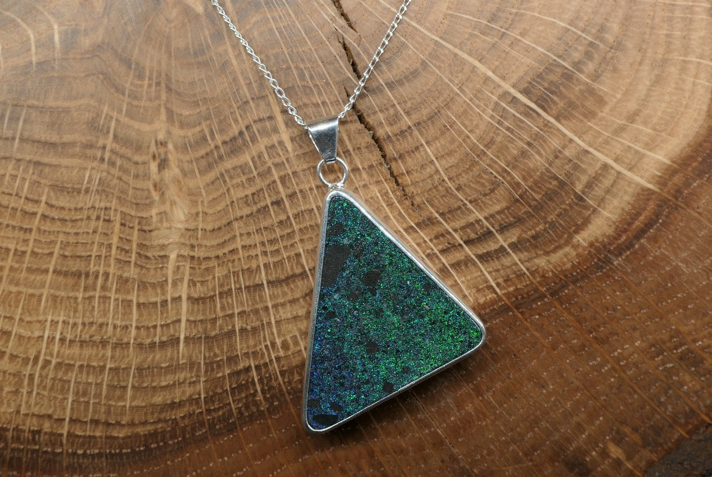 Silver opal pendant with an Andamooka matrix opal