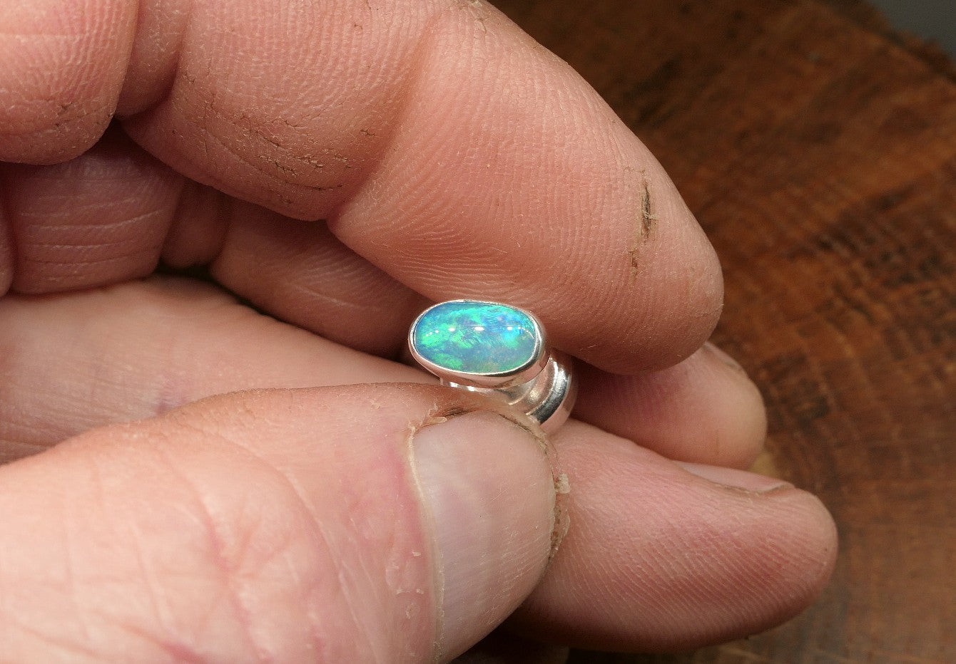 Silver tie tack with a Coober Pedy opal