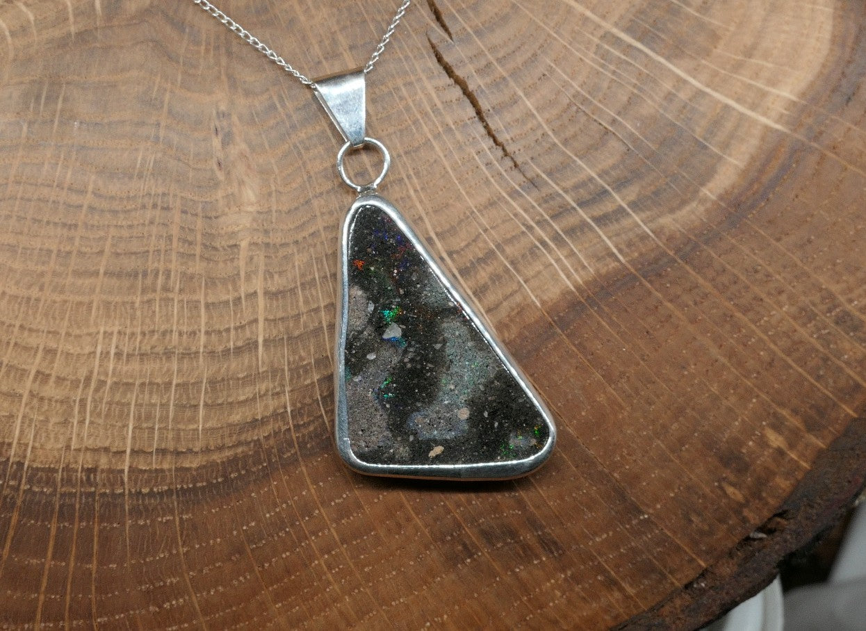Double sided silver pendant with a Honduran matrix opal