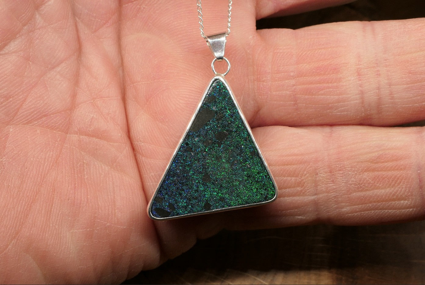 Silver opal pendant with an Andamooka matrix opal