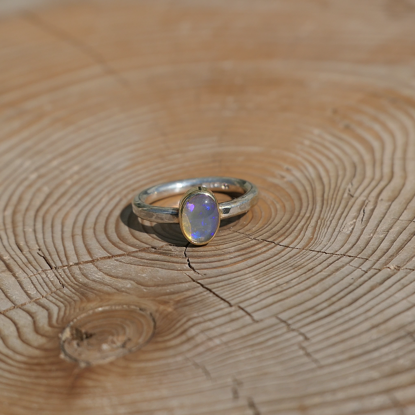 Silver opal ring with 18k gold bezel