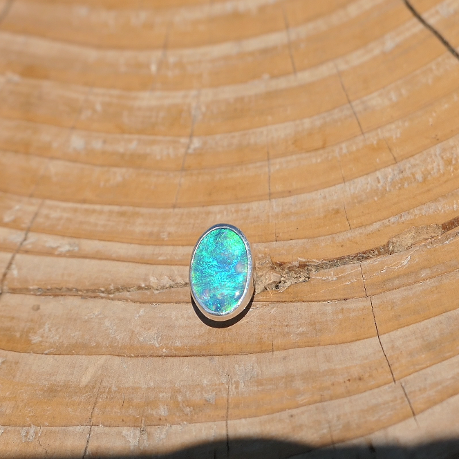 Silver tie tack with Coober Pedy opal.